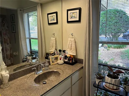 a bathroom with a sink and a mirror