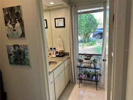 a kitchen with a refrigerator and a stove