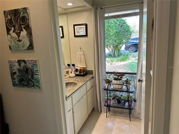 a kitchen with a refrigerator and a stove