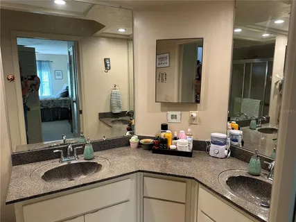 a bathroom with sink and mirror