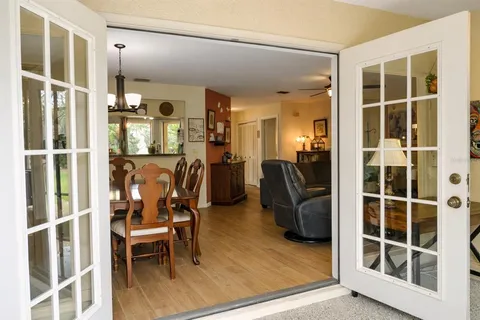 a view of a livingroom with furniture and a window