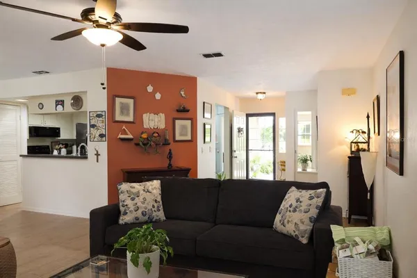 a living room with furniture and a large window