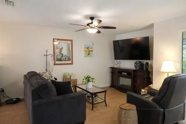 a living room with furniture and a flat screen tv