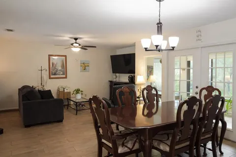 a view of a dining room with furniture window and outside view
