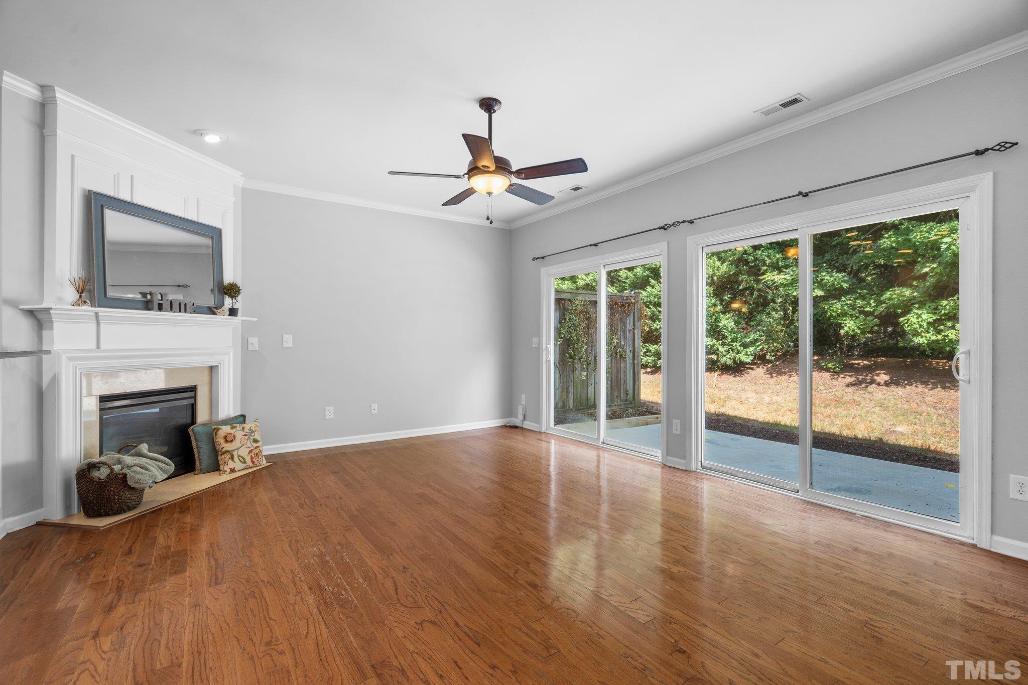 8308 Pilots View Drive Raleigh, NC 27617 - Photo 11 of 29 a view of livingroom with furniture fireplace and window