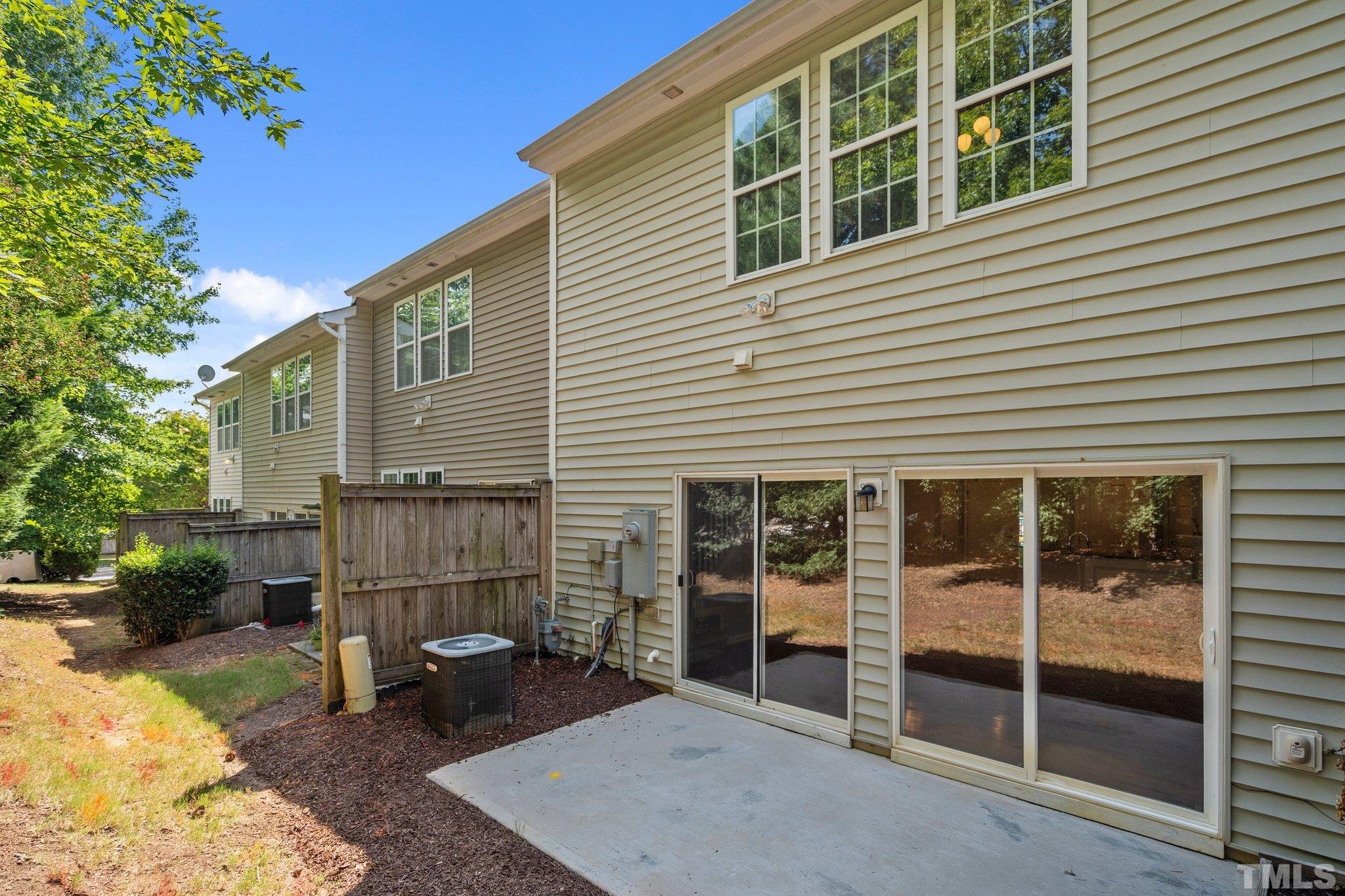 8308 Pilots View Drive Raleigh, NC 27617 - Photo 14 of 29 a backyard of a house with seating space