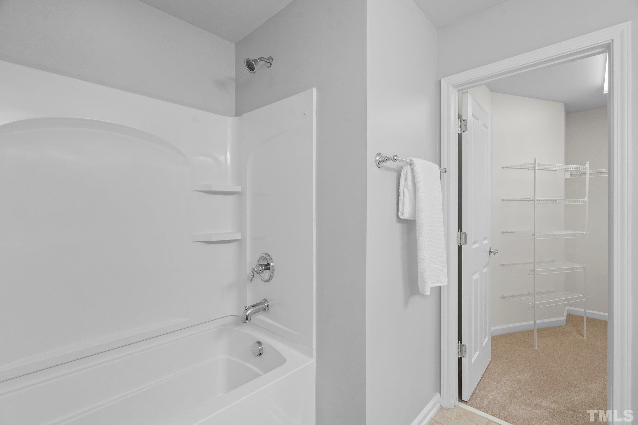 8308 Pilots View Drive Raleigh, NC 27617 - Photo 19 of 29 a bathroom with a bathtub and shower