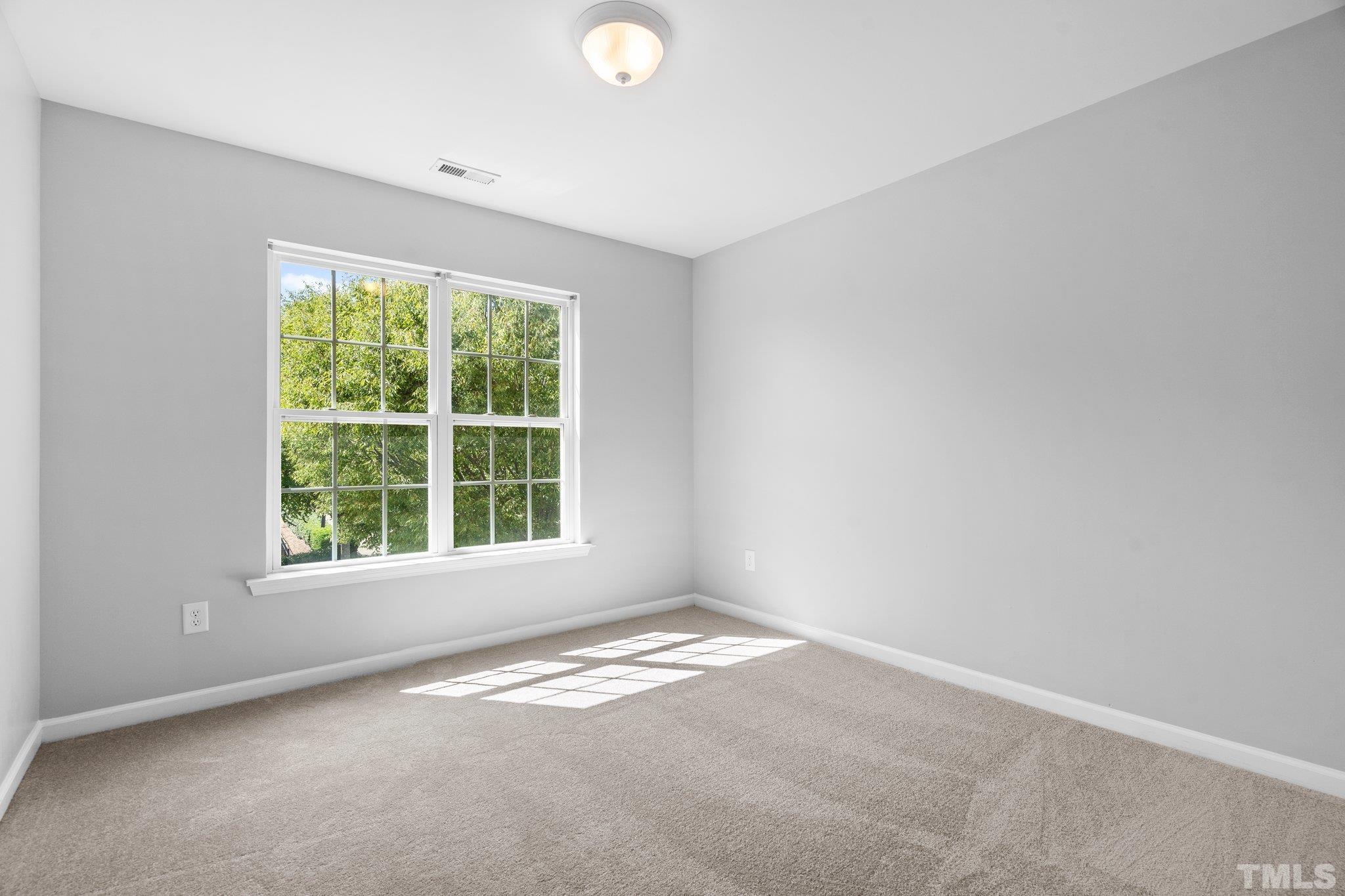 8308 Pilots View Drive Raleigh, NC 27617 - Photo 21 of 29 an empty room with a window