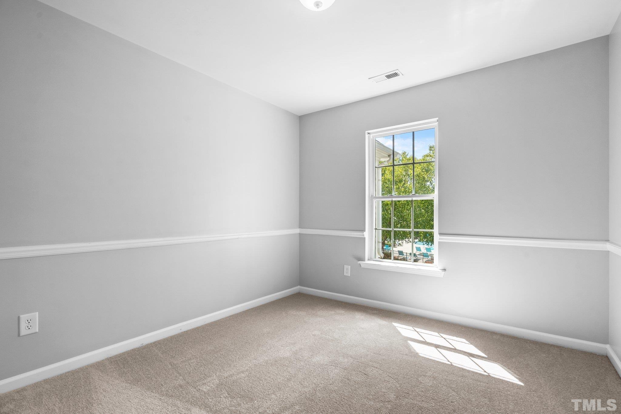 8308 Pilots View Drive Raleigh, NC 27617 - Photo 25 of 29 an empty room with a window
