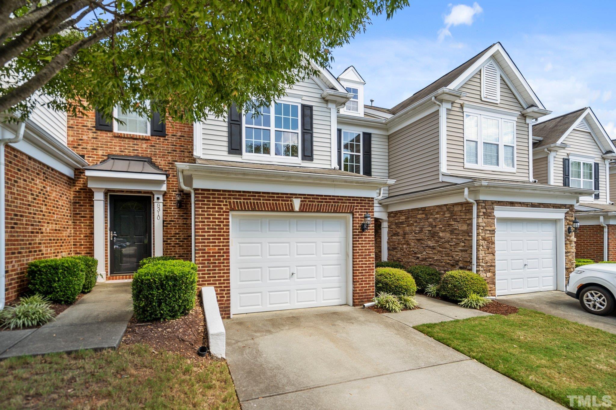 8308 Pilots View Drive Raleigh, NC 27617 - Photo 28 of 29 a front view of a house with a yard and garage