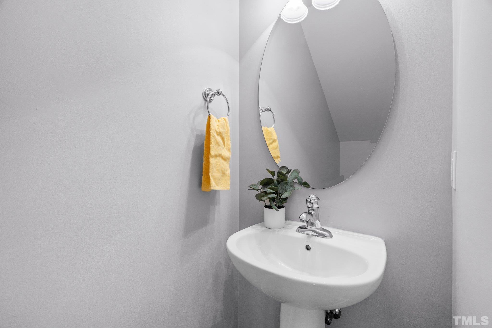 8308 Pilots View Drive Raleigh, NC 27617 - Photo 10 of 29 a bathroom with a sink and a mirror