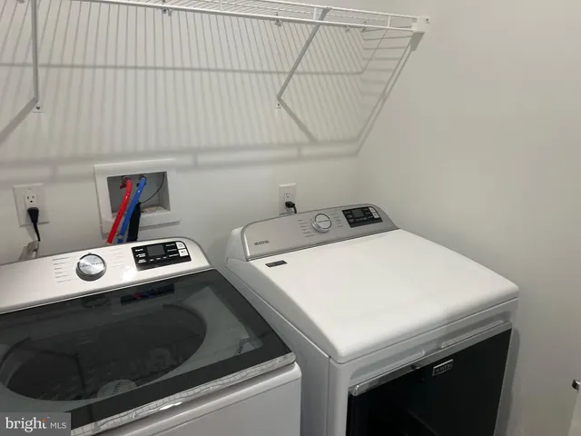 a view of wooden floor and windows in a room