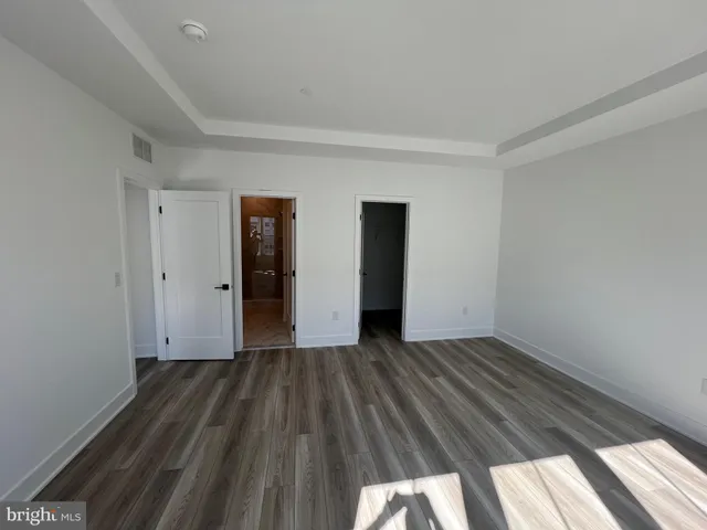 a bathroom with a double vanity sink mirror and shower