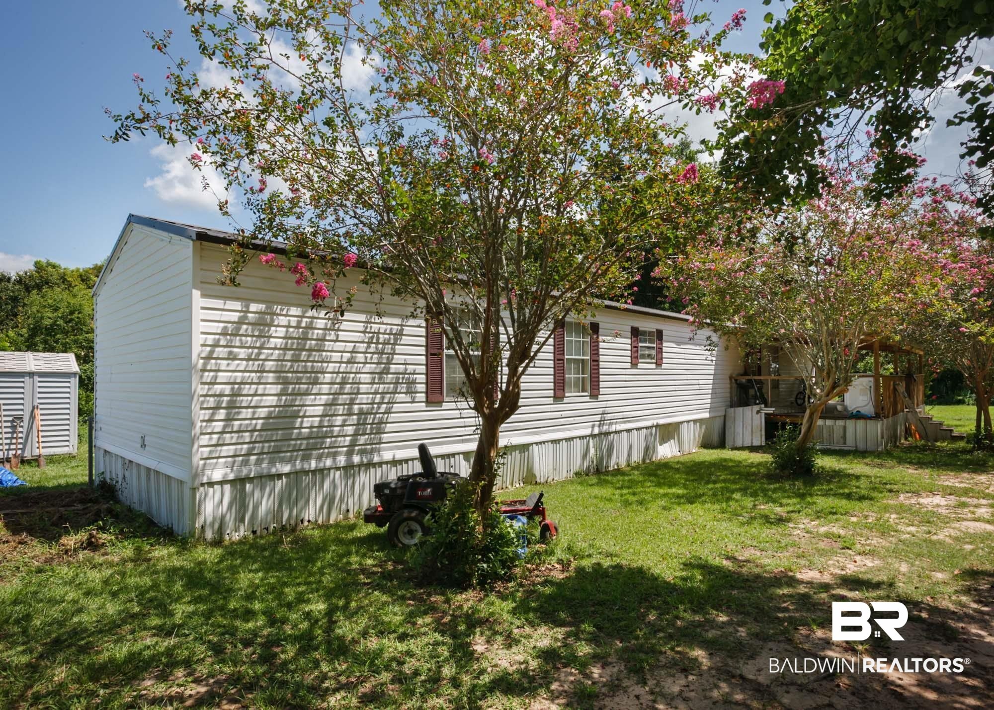 14005 County Road 49 Foley, AL 36535 - Photo 1 of 38 View of side of property featuring a lawn