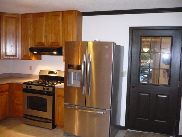 1086 Country Club Road Fort Valley, GA 31030 - Photo 2 of 7 a kitchen with a refrigerator stove and microwave
