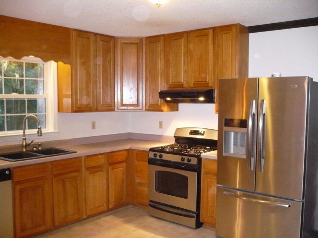 1086 Country Club Road Fort Valley, GA 31030 - Photo 3 of 7 a kitchen with a refrigerator stove and sink