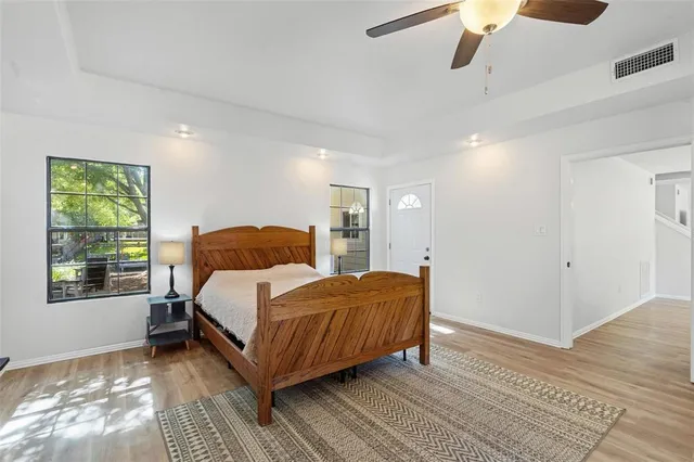 a bed room with a bed and a window