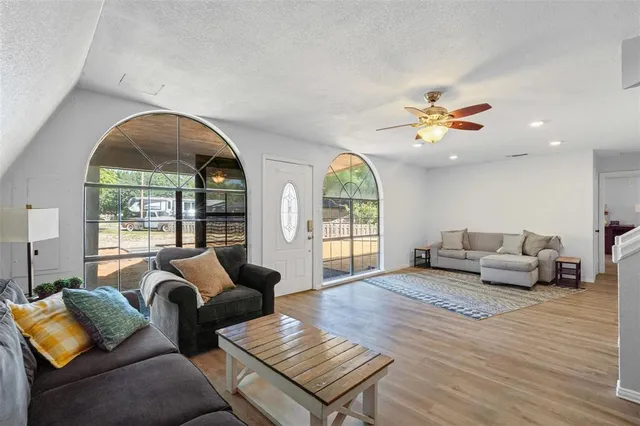 a living room with furniture and a large window