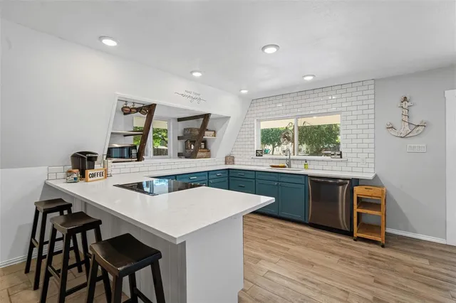 a kitchen with a table and chairs in it