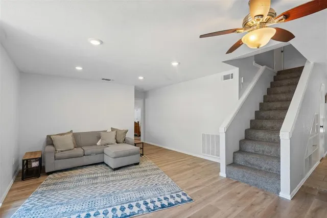 a living room with furniture and a rug
