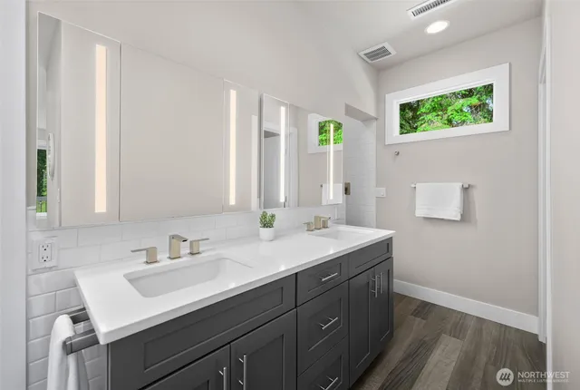 a bathroom with a sink and a mirror