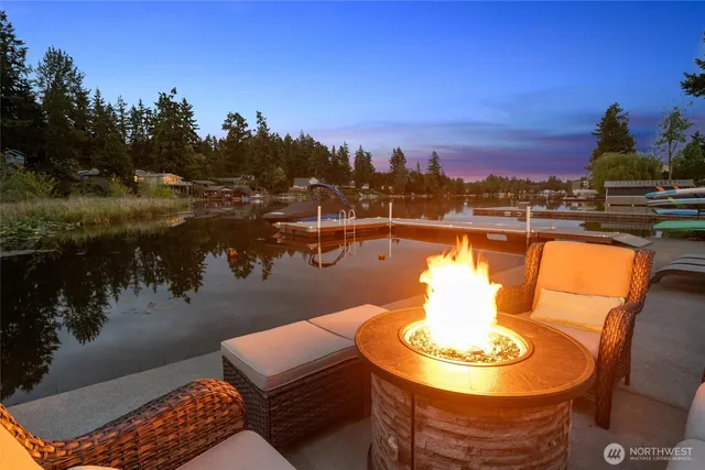 a outdoor sitting area with a lake view and lake view