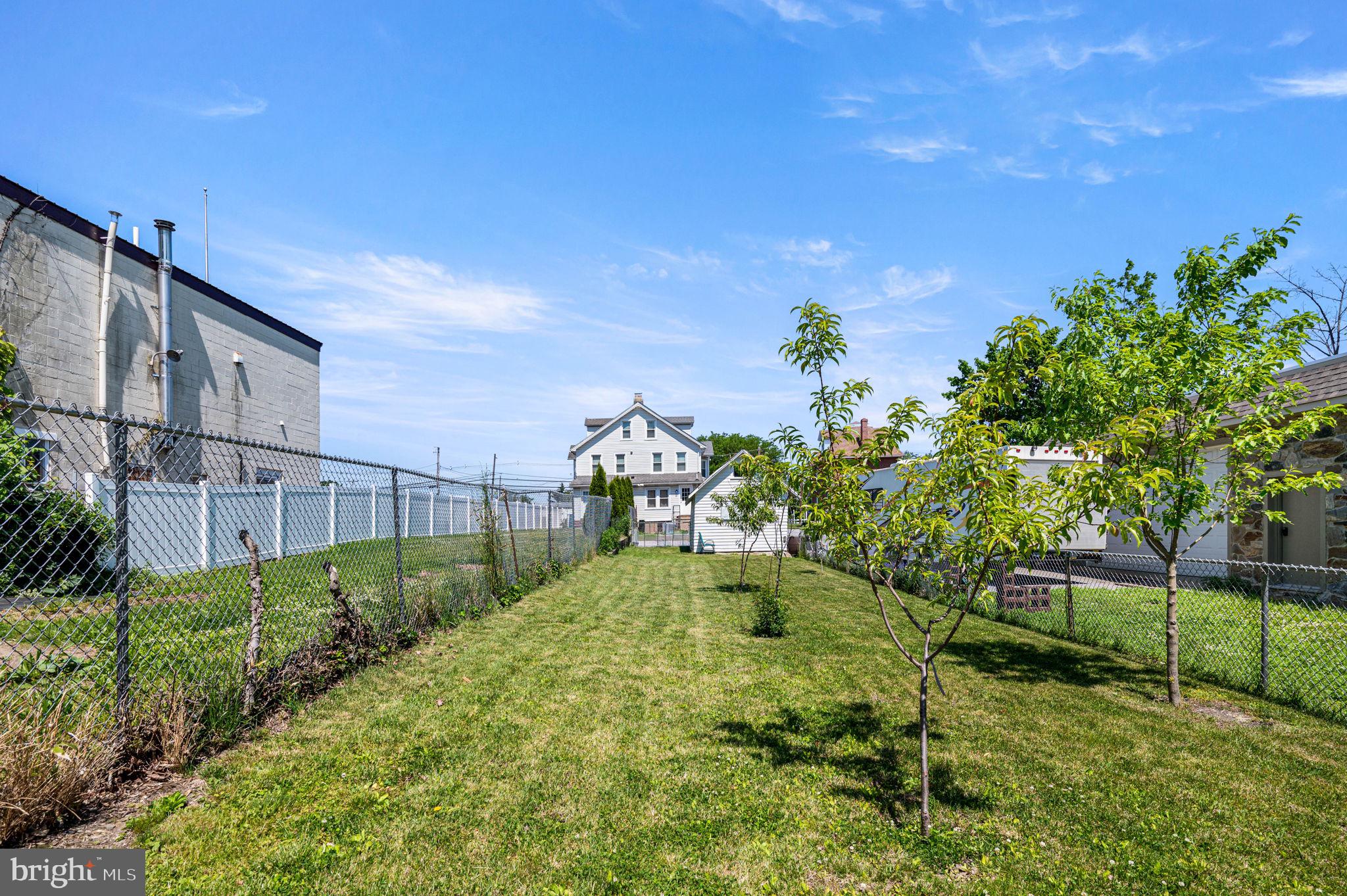 19 State Road Media, PA 19063 - Photo 18 of 18 a view of a garden with a house in the background