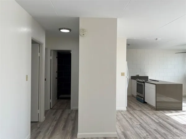 a view of a kitchen from the hallway