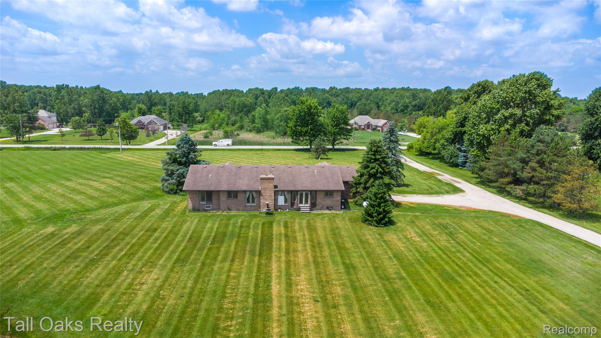 79330 Capac Road Armada, MI 48005 - Photo 17 of 42 Spacious property featuring a brick exterior and a brown shingle roof