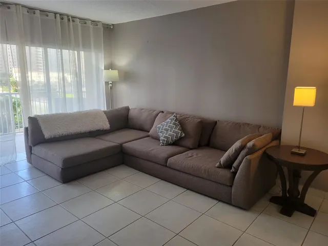 a living room with couches and a coffee table