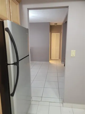 a view of a kitchen with an empty space