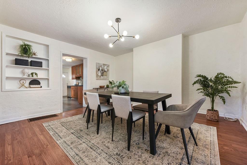 1302 Boyle Street Pittsburgh, PA 15212 - Photo 12 of 50 a view of a dining room with furniture and wooden floor