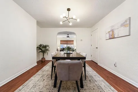 a dining room with furniture and window