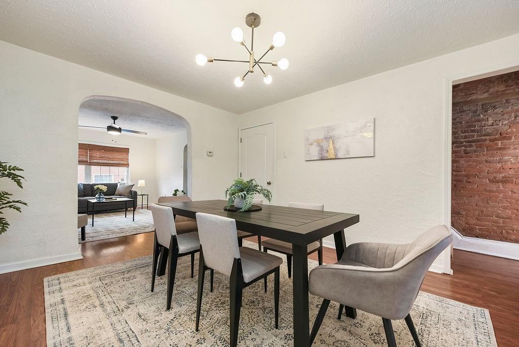 1302 Boyle Street Pittsburgh, PA 15212 - Photo 15 of 50 a view of a dining room with furniture and wooden floor
