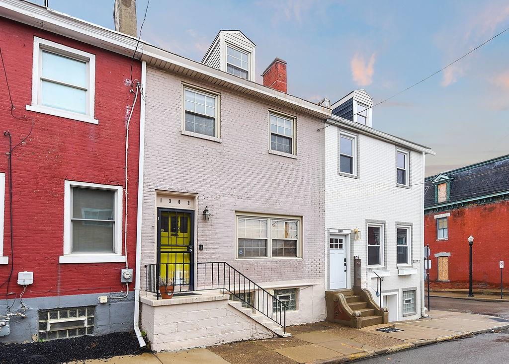 1302 Boyle Street Pittsburgh, PA 15212 - Photo 2 of 50 a front view of a house with many windows
