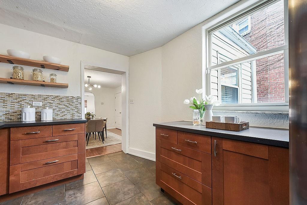 1302 Boyle Street Pittsburgh, PA 15212 - Photo 21 of 50 a kitchen with a sink and cabinets