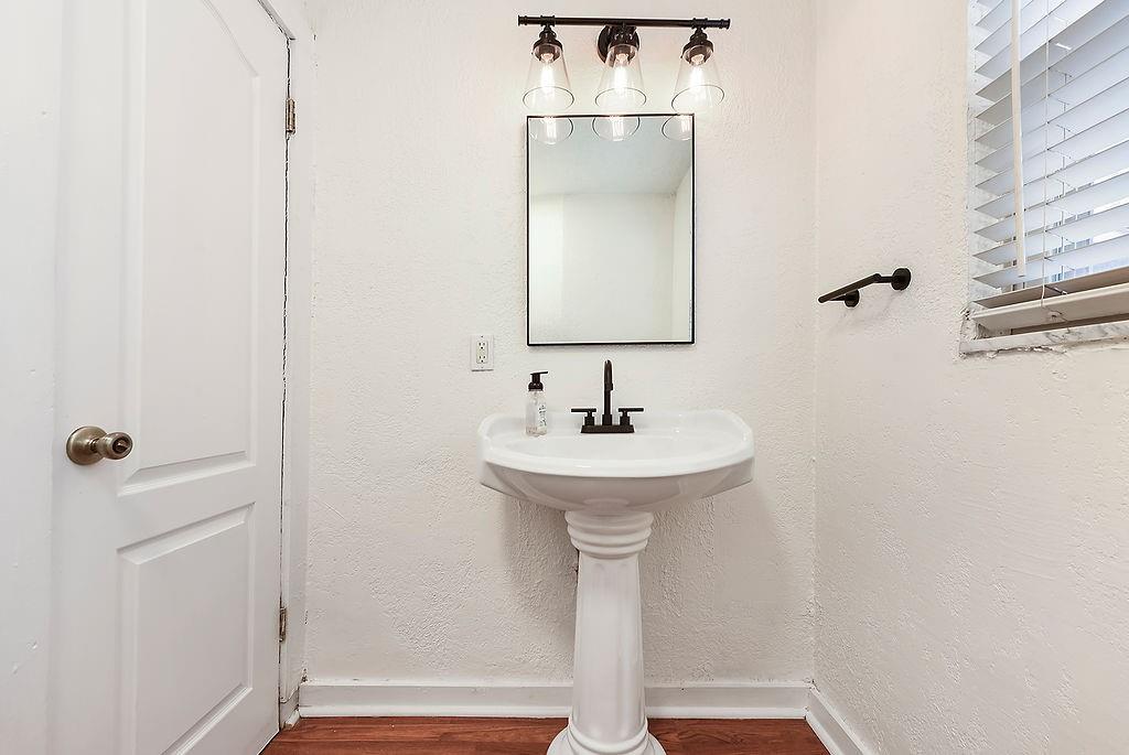 1302 Boyle Street Pittsburgh, PA 15212 - Photo 22 of 50 a bathroom with a sink a mirror and shower