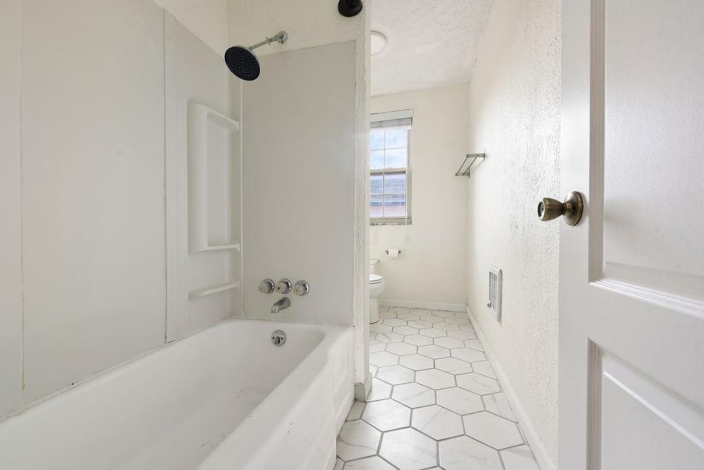 1302 Boyle Street Pittsburgh, PA 15212 - Photo 42 of 50 a bathroom with a bathtub and a shower