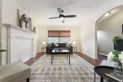 a living room with furniture and a window
