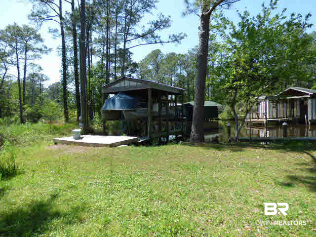 7453 Fairmont Drive Foley, AL 36535 - Photo 21 of 25 lot located next to hanging boat on the left.