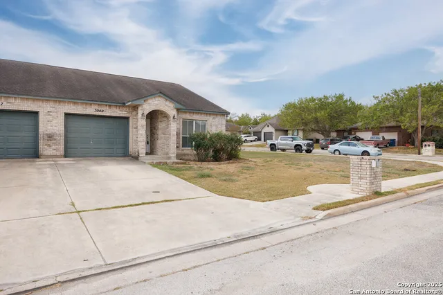 a view of the house with a swimming pool