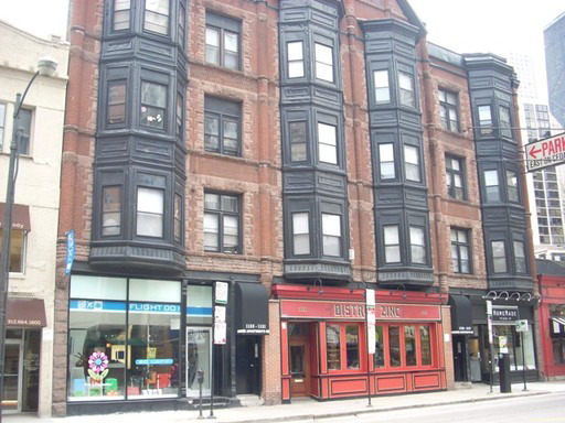 a view of a building on a street
