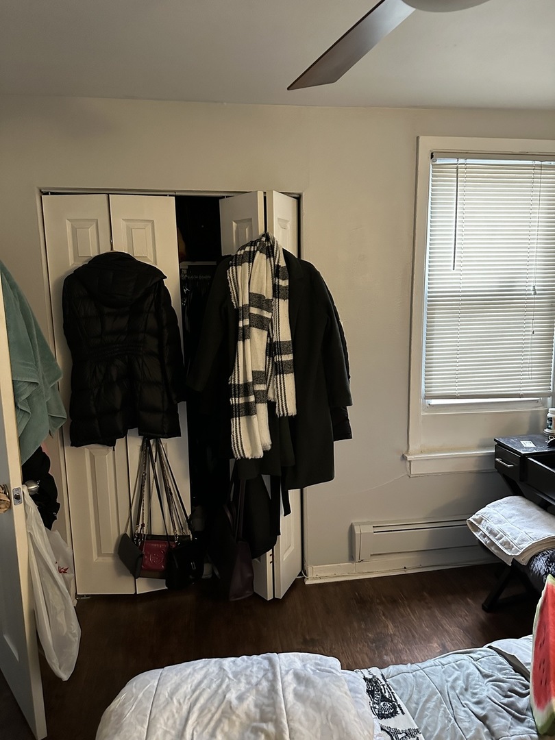 1127 North State Street, Unit 2A Chicago, IL 60611 - Photo 11 of 11 a bedroom with a bed and window