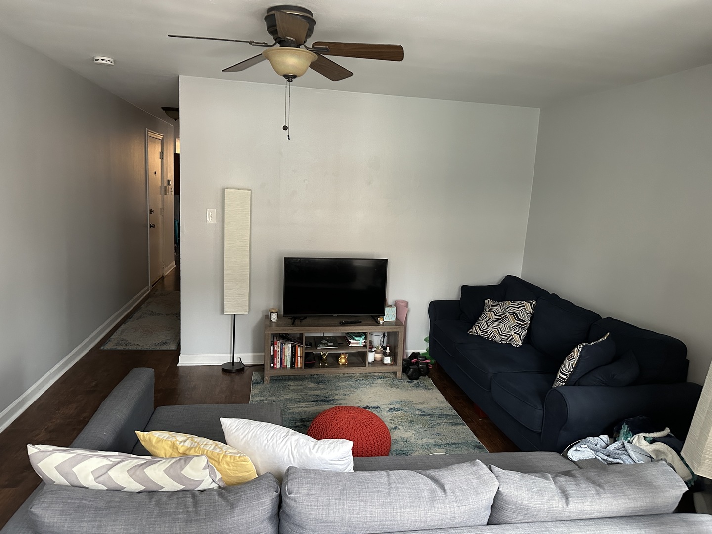 1127 North State Street, Unit 2A Chicago, IL 60611 - Photo 8 of 11 a living room with furniture and a flat screen tv