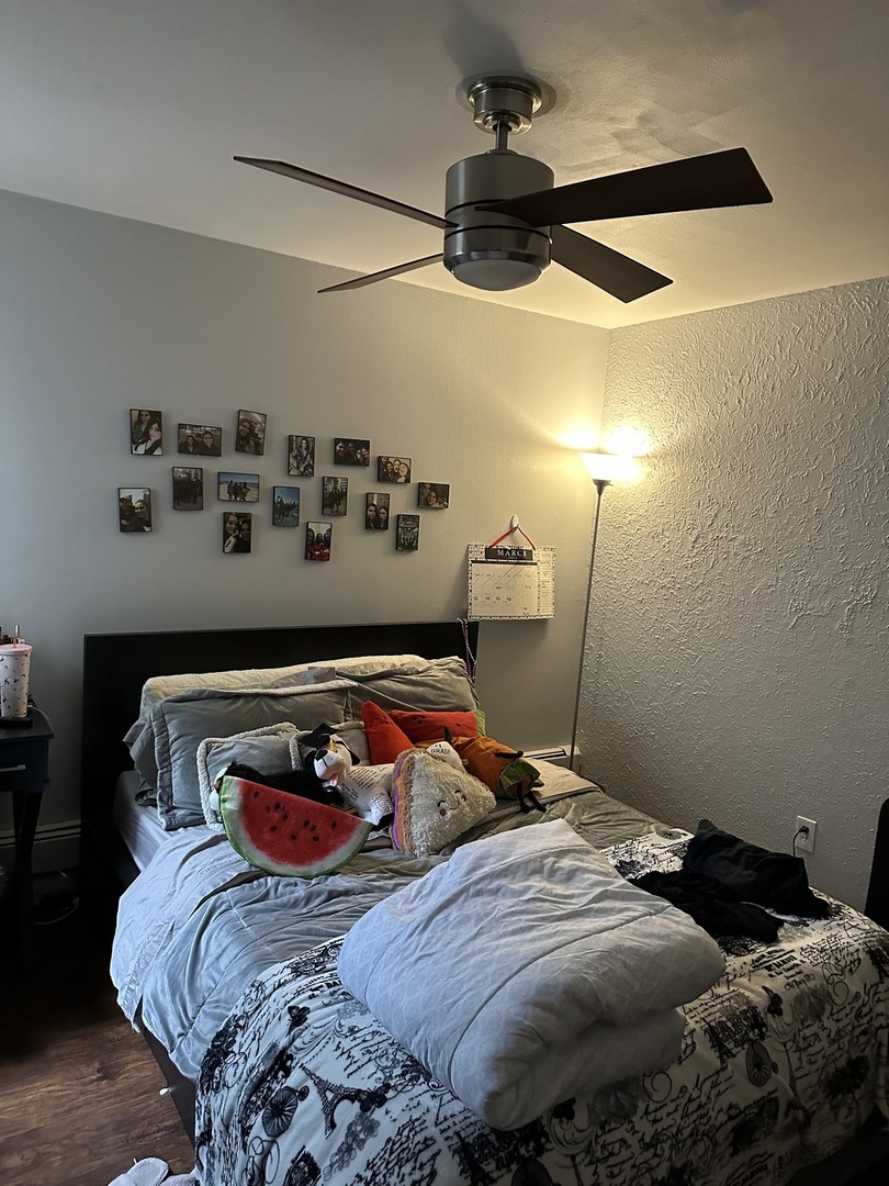 1127 North State Street, Unit 2A Chicago, IL 60611 - Photo 9 of 11 a bedroom with two beds and painting on the wall