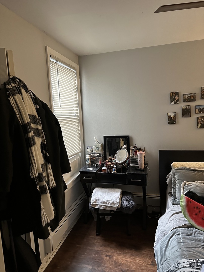 1127 North State Street, Unit 2A Chicago, IL 60611 - Photo 10 of 11 a bedroom with a bed and a window
