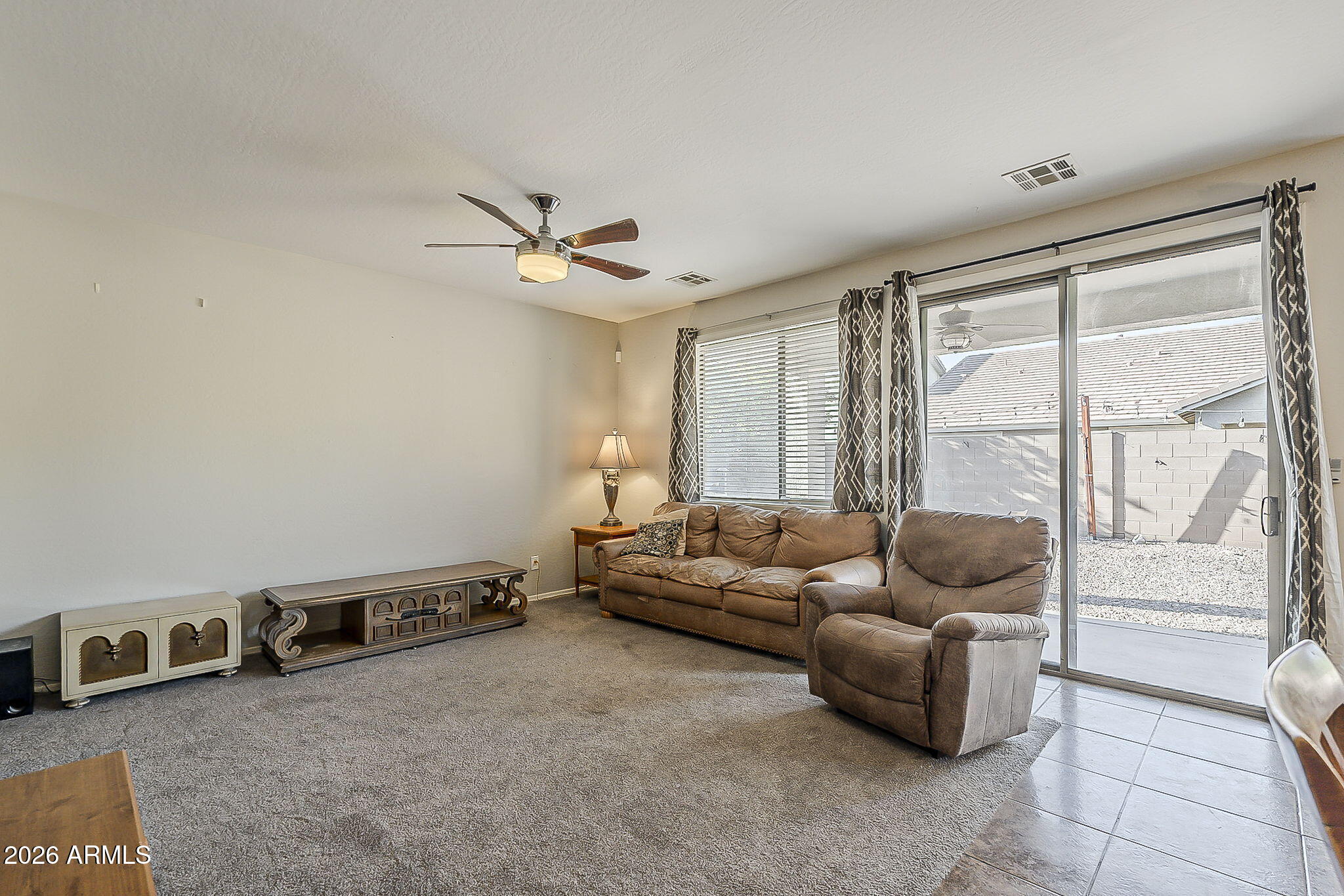 3816 East Phelps Street Gilbert, AZ 85295 - Photo 12 of 47 a living room with furniture and a large window
