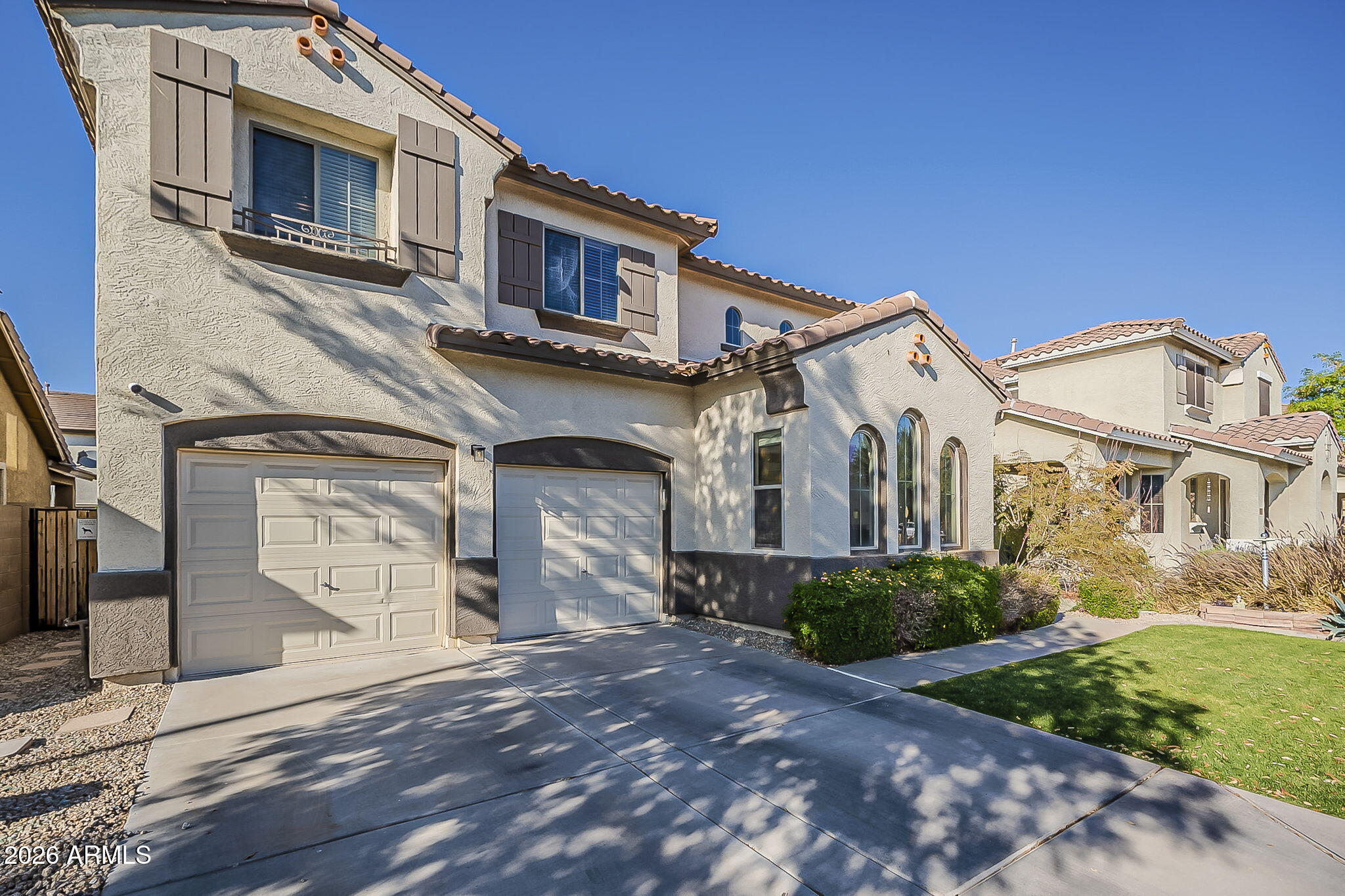 3816 East Phelps Street Gilbert, AZ 85295 - Photo 2 of 47 a front view of a house with garden