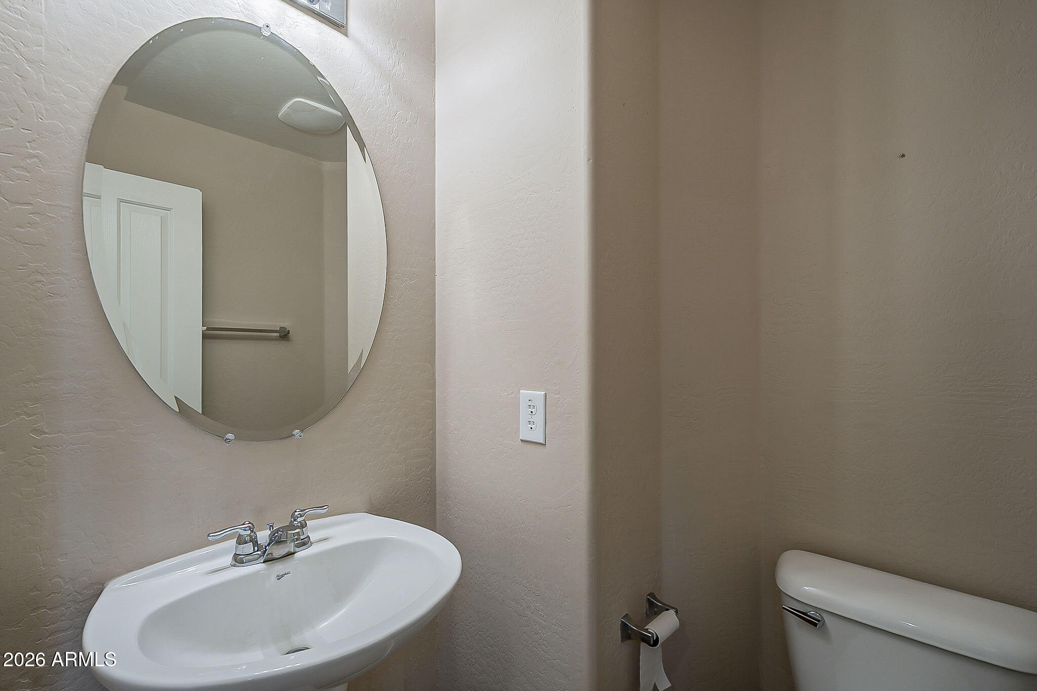 3816 East Phelps Street Gilbert, AZ 85295 - Photo 23 of 47 a bathroom with a sink a mirror and toilet