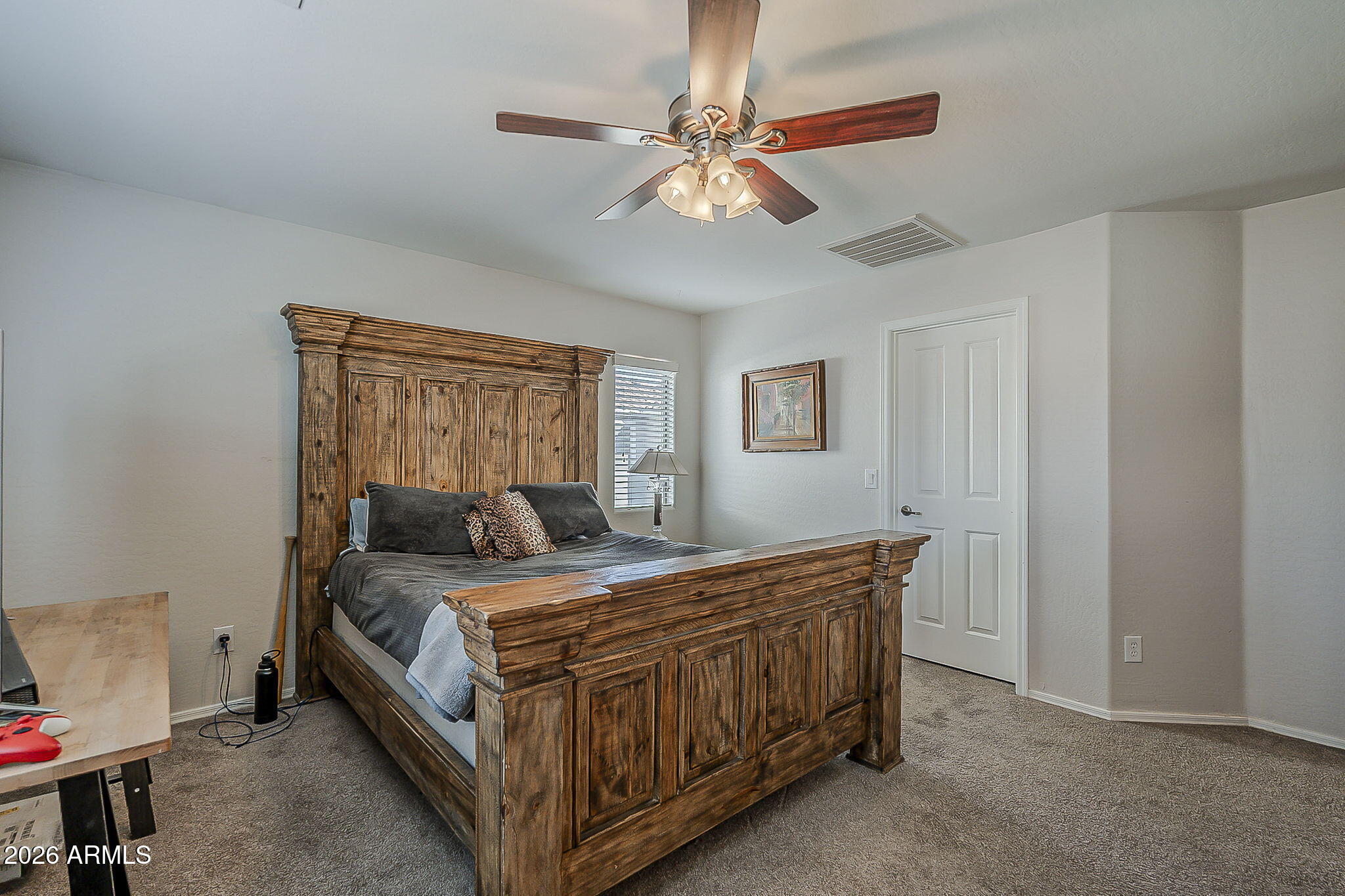 3816 East Phelps Street Gilbert, AZ 85295 - Photo 25 of 47 a bedroom with a bed and a chandelier